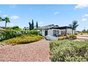 Attractive single-Gathering home with a manicured lawn, decorative brick, and covered porch at 13207 N 55Th Ave, Glendale, AZ 85304