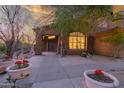 Inviting front entrance with stylish desert landscaping and a charming, tiled walkway at 14056 E Desert Cove Ave, Scottsdale, AZ 85259