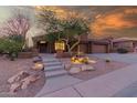 Charming desert home showcasing unique cactus landscaping and a welcoming front entrance at 14056 E Desert Cove Ave, Scottsdale, AZ 85259