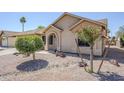 Charming home featuring desert landscaping, mature trees, and a welcoming facade at 1519 E Indian Wells Dr, Chandler, AZ 85249