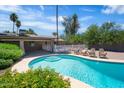 Backyard pool with patio and outdoor seating, perfect for relaxing on a sunny day at 18428 N 42Nd St, Phoenix, AZ 85032