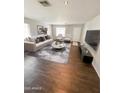 Open-concept living room featuring neutral decor, recessed lighting, and seamless flow at 25862 W North Star Pl, Buckeye, AZ 85326