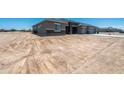 Expansive front yard of new home in desert community, awaiting landscaping to complete its curb appeal at 30639 N Dorado Ct, Queen Creek, AZ 85144