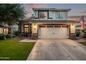 Beautiful two-story home with a manicured lawn, two-car garage, and cozy front porch at 3466 E Bruce Ave, Gilbert, AZ 85234