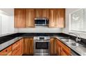 Stylish kitchen featuring granite countertops, stainless steel appliances, and custom cabinetry at 4225 N 21St St # 22, Phoenix, AZ 85016
