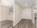 Living room features wood-style flooring, neutral paint, natural light, and sliding door at 520 N Stapley Dr # 257, Mesa, AZ 85203