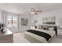 Serene bedroom with a comfortable bed, nightstands, and soft natural light from the window at 533 W Guadalupe Rd # 2126, Mesa, AZ 85210