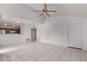 Bright, open-concept living area with tile floors and a ceiling fan, perfect for entertaining at 533 W Guadalupe Rd # 2126, Mesa, AZ 85210