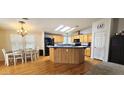 Bright kitchen with breakfast bar and skylights providing ample natural light at 8902 E Baltimore St, Mesa, AZ 85207