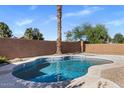 Sparkling backyard pool with decorative tile and a tranquil setting, perfect for enjoying sunny days at 9632 E Olla Ave, Mesa, AZ 85212