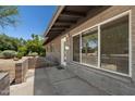 Close up of exterior wall with large windows and concrete pavers at 105 E Hermosa Dr, Tempe, AZ 85282