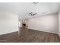 Spacious living room featuring wood-look floors, a ceiling fan and fresh paint at 105 E Hermosa Dr, Tempe, AZ 85282