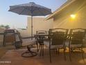Enjoy the backyard patio with ample seating, a patio umbrella, and a built-in grill at 1055 N 86Th Pl, Scottsdale, AZ 85257