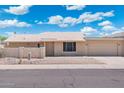 Single-story home featuring a two-car garage and neutral exterior paint at 1055 N 86Th Pl, Scottsdale, AZ 85257
