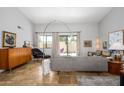 Stylish living room boasts travertine floors, modern furnishings, and natural light at 1124 E Rose Ln # 17, Phoenix, AZ 85014