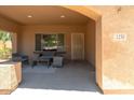 Relaxing front porch area with cushioned seating and a view of the neighborhood at 1250 E Canyon Creek Dr, Gilbert, AZ 85295
