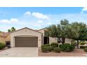 Inviting single-story home featuring desert landscaping, a two-car garage, and a neatly maintained front yard at 13414 W San Pablo Dr, Sun City West, AZ 85375