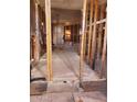 Stripped-down interior view showcasing exposed framing, potential for customized renovation with abundant natural light at 1416 E Southern Ave, Apache Junction, AZ 85119