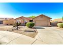 Single-Gathering house with a xeriscaped front yard, two-car garage and neutral color scheme at 1492 E Westchester Dr, Chandler, AZ 85249