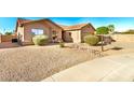 Charming home with xeriscaped front yard and covered entryway, complemented by a tile roof at 1492 E Westchester Dr, Chandler, AZ 85249