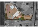 Aerial view of the property highlighting the layout, backyard features, and the surrounding neighborhood in black and white at 1637 W University Dr, Mesa, AZ 85201