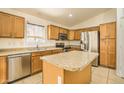 Well-equipped kitchen with stainless steel appliances and granite countertops at 17617 W Corrine Dr, Surprise, AZ 85388