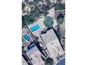 Aerial view of a backyard with a pool, waterslide, and trampoline at 1766 N Channing --, Mesa, AZ 85207