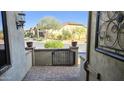 Inviting entryway with a decorative wrought iron gate leading to the front door at 1766 N Channing --, Mesa, AZ 85207