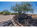 Community entrance sign with desert landscaping and paver entry at 19947 N 94Th Way, Scottsdale, AZ 85255