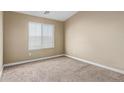 Cozy bedroom with neutral carpet, a window for natural light, and a blank canvas for personalization at 240 W Juniper Ave # 1211, Gilbert, AZ 85233