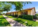 Inviting single-story home with neatly trimmed front yard landscaping and a paved walkway on a bright, sunny day at 2442 N 22Nd Ave, Phoenix, AZ 85009