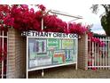 View of the Bethany Crest Co-Op map surrounded by bright, blooming bougainvillea at 2530 W Berridge Ln # E111, Phoenix, AZ 85017