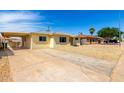 View of the house exterior and driveway featuring low maintenance gravel yard at 2802 W Butler Dr, Phoenix, AZ 85051