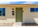 Close up of the front entrance with a green door and the house number 2802 at 2802 W Butler Dr, Phoenix, AZ 85051