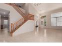 Spacious living room featuring a grand staircase and tiled floors at 33512 N 24Th Ln, Phoenix, AZ 85085