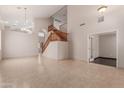 Spacious living room with stairs, high ceilings, and tile flooring at 33512 N 24Th Ln, Phoenix, AZ 85085