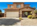 Charming two-story home boasts a two-car garage and a cozy covered porch at 33602 N Cobble Stone Dr, San Tan Valley, AZ 85143