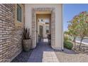 Inviting entrance featuring a decorative brick archway and views of the interior at 35486 N Morello Dr, Queen Creek, AZ 85140