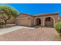Charming single-story home featuring a low-maintenance desert landscape, covered entryway and a two car garage at 3719 W Carson Rd, Phoenix, AZ 85041