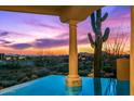Stunning pool view with desert landscape and sunset at 40635 N 109Th Pl # 3 & 5, Scottsdale, AZ 85262