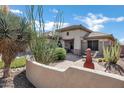 Charming home with a private front patio and unique desert landscaping at 41215 N Lytham Ct, Phoenix, AZ 85086