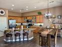 Spacious kitchen features a large island, stainless steel appliances, and custom cabinetry at 41215 N Lytham Ct, Phoenix, AZ 85086