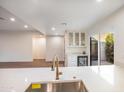 Bright and modern kitchen featuring stone countertops, stainless steel sink and a courtyard view at 4525 N 66Th St # 95, Scottsdale, AZ 85251