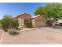 Desirable single-level house with a well-kept lawn and a functional two-car garage at 5439 W Sands Rd, Glendale, AZ 85301