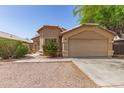 Inviting single-Gathering home with a manicured front yard and a convenient two-car garage at 5439 W Sands Rd, Glendale, AZ 85301