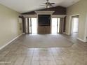 Large living room with neutral walls, tile flooring, and sliding glass doors for ample natural light at 6436 W Saddlehorn Rd, Phoenix, AZ 85083