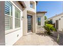 Charming single-story home entrance with a modern-designed door and well-maintained landscaping at 70 E Kennedia Dr, Queen Creek, AZ 85140