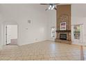 Bright living room with tile flooring, a fireplace, high ceilings and abundant natural light at 725 W Beth Dr, Phoenix, AZ 85041