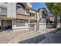 Townhome exterior showcasing stucco walls, tile roof, and well-maintained gravel landscaping on a sunny day at 818 S Westwood -- # 101, Mesa, AZ 85210