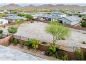 A spacious backyard ready for personalization, set against a backdrop of natural desert beauty at 16551 W Winston Dr, Goodyear, AZ 85338